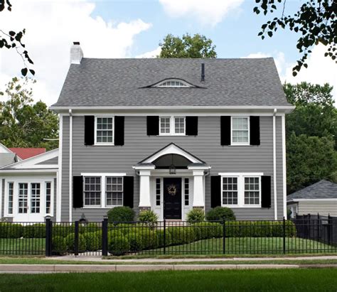 grey house with metal roof|grey houses with black shutters.